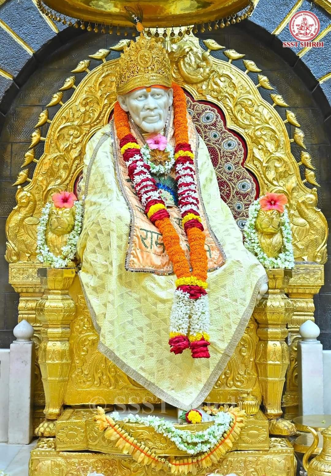 Sai Baba Shirdi statue golden backdrop