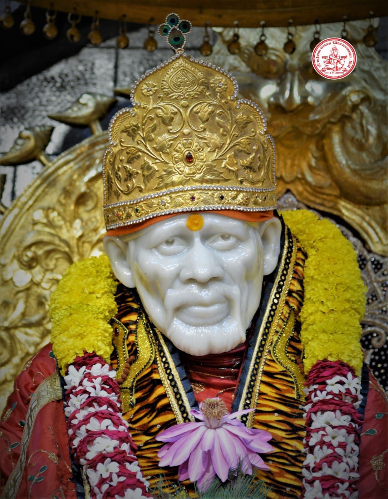 Shirdi Sai Baba idol with flower garland