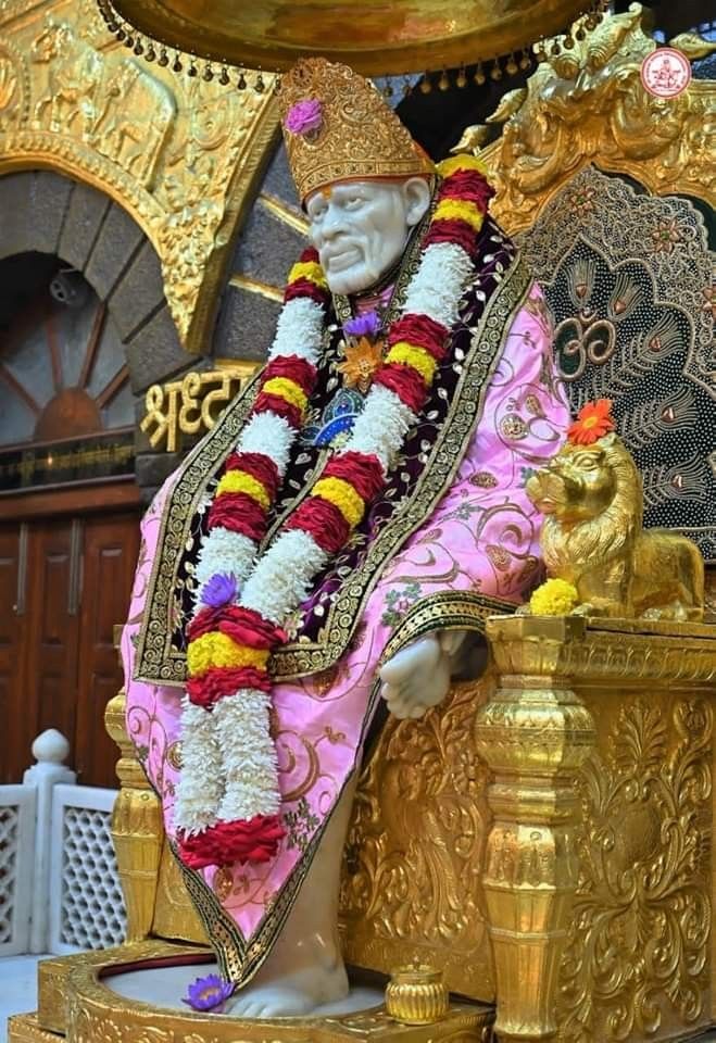 Sai Baba on ornate golden throne