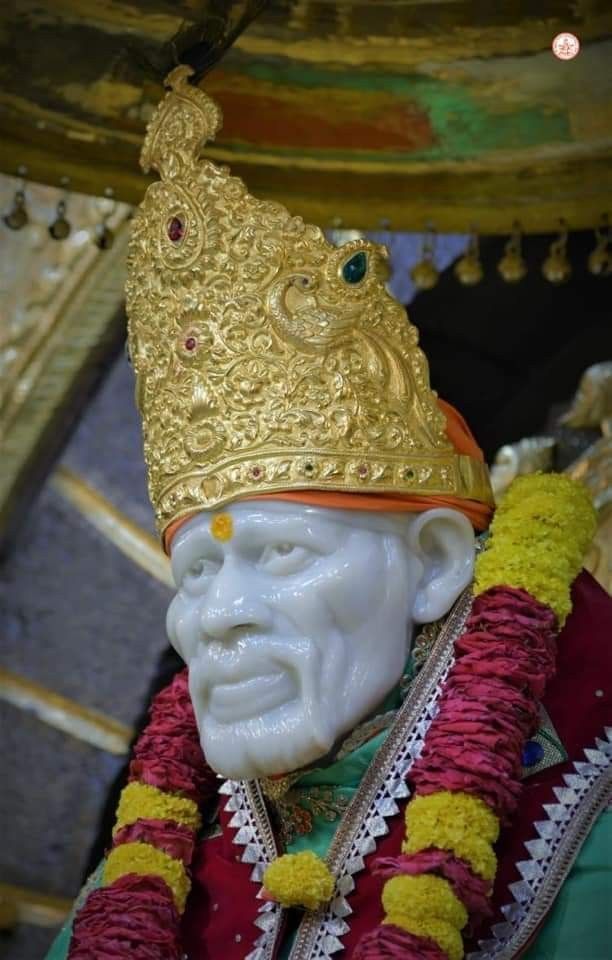 Sai Baba with ornate golden crown