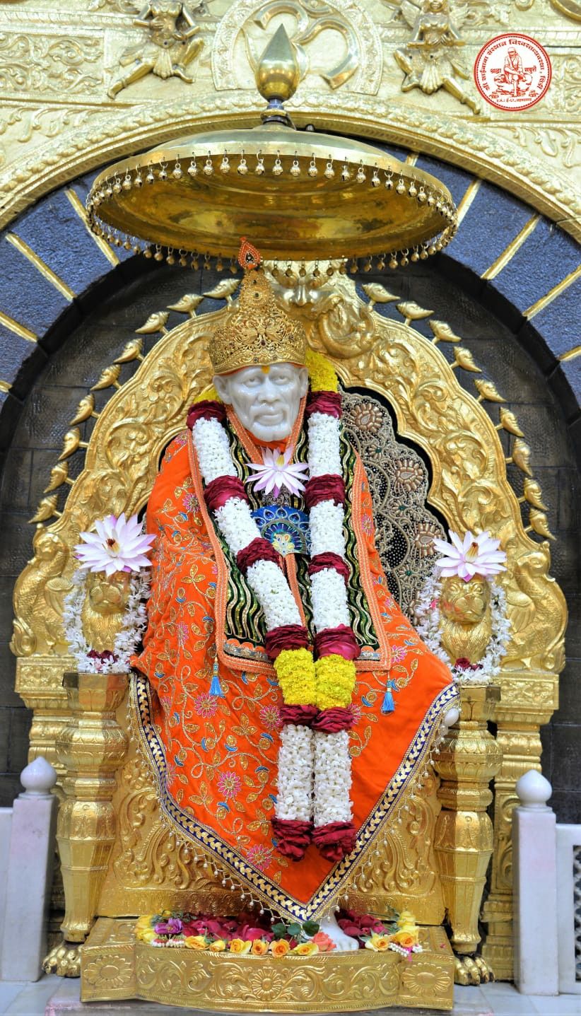 Sai Baba seated in golden temple