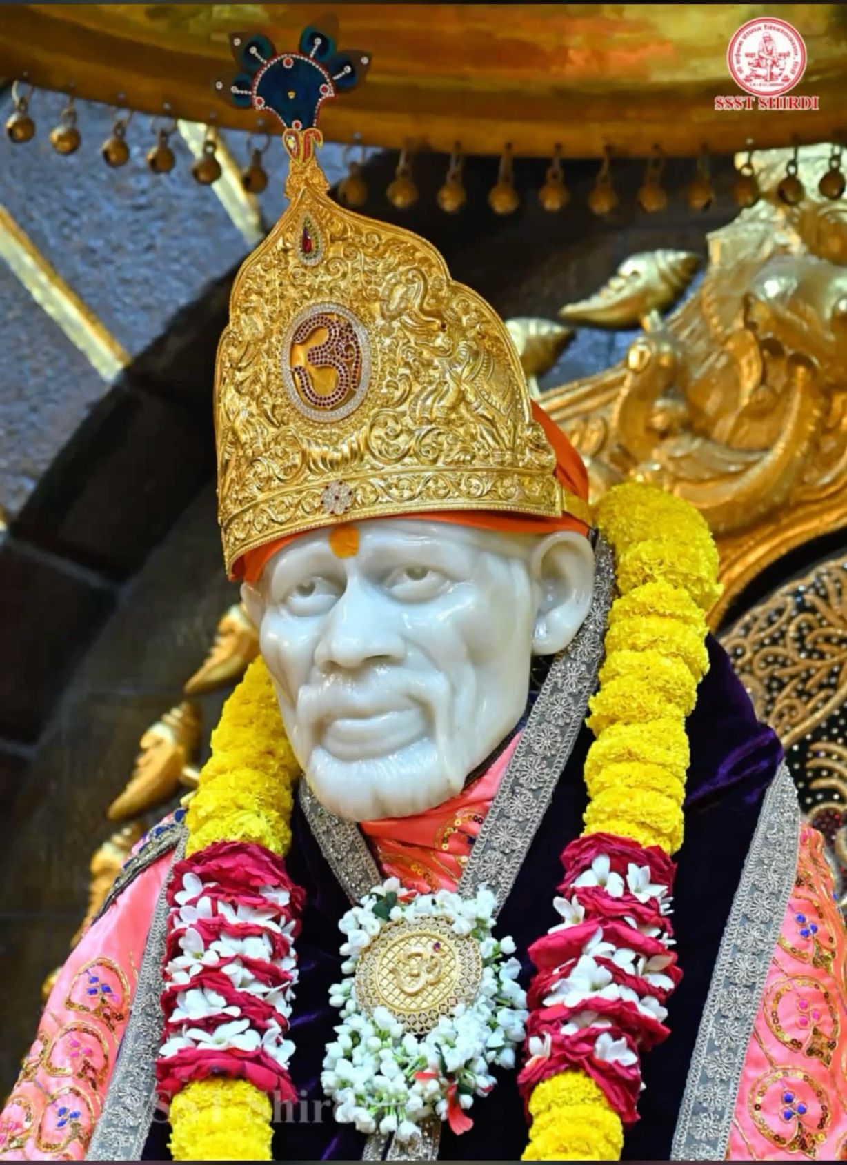 Sai Baba idol with floral garlands