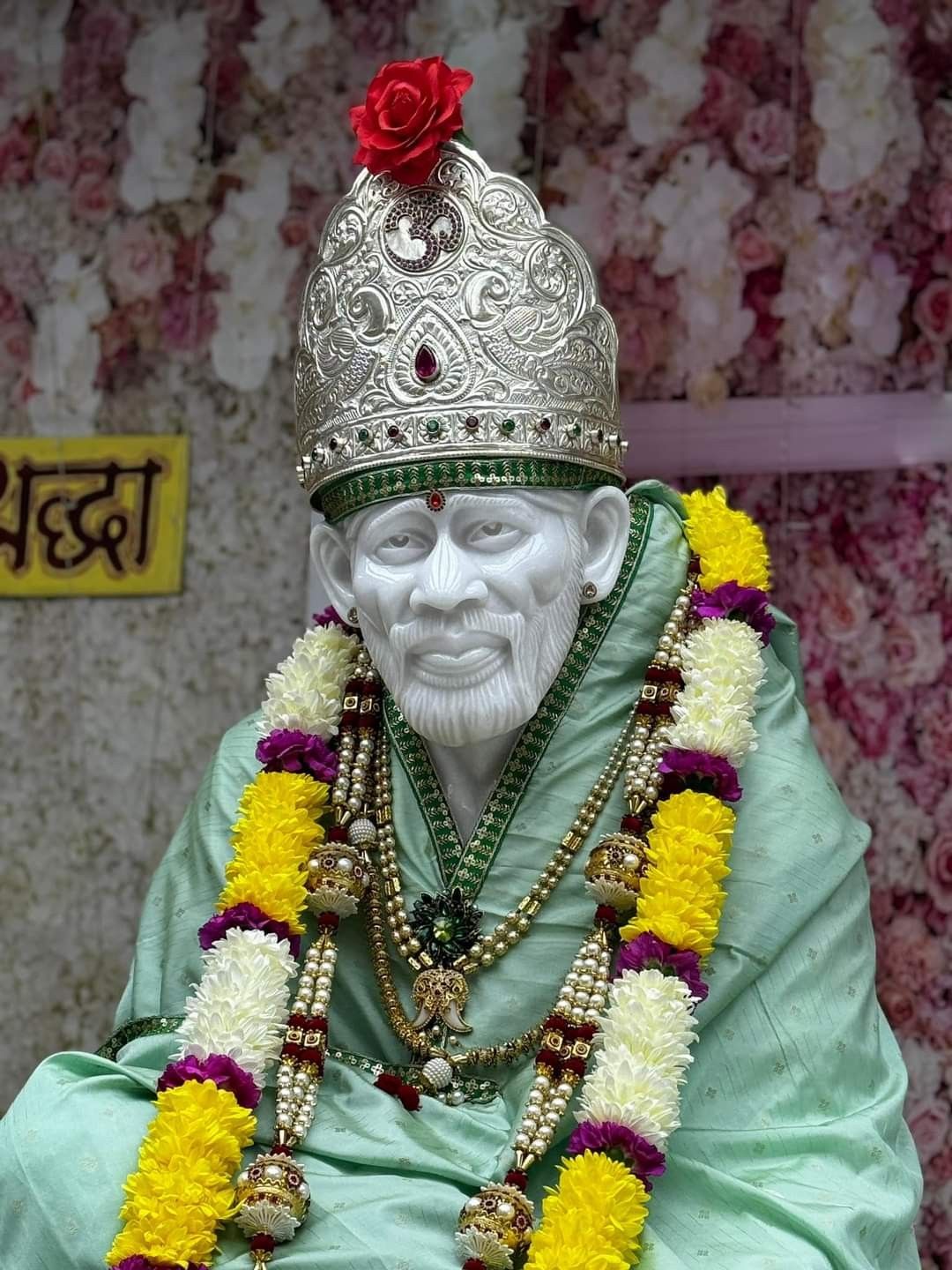 Sai Baba with floral decorations