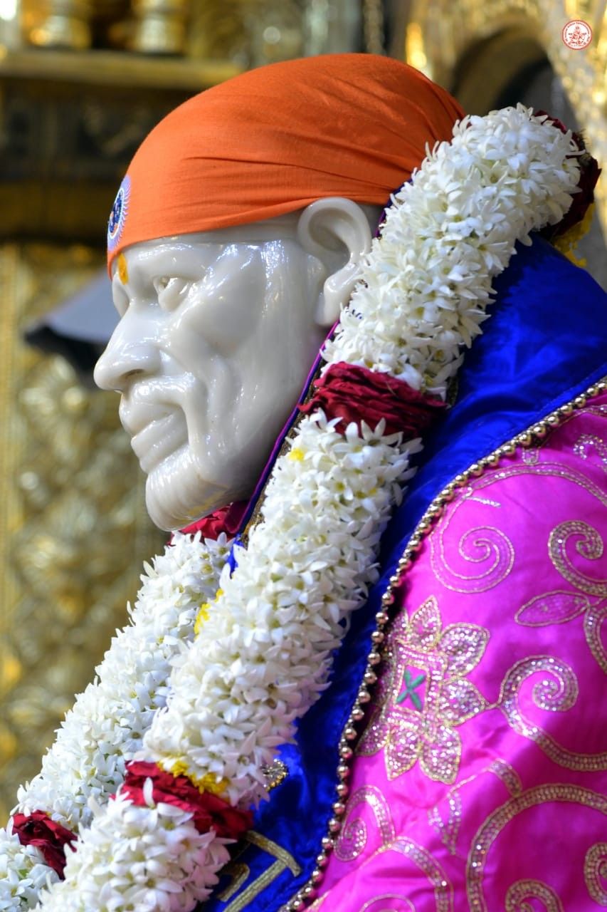 Sai Baba with flower garland portrait