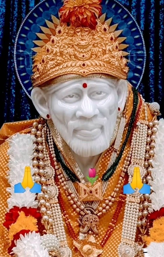 Sai Baba statue with devotional offering