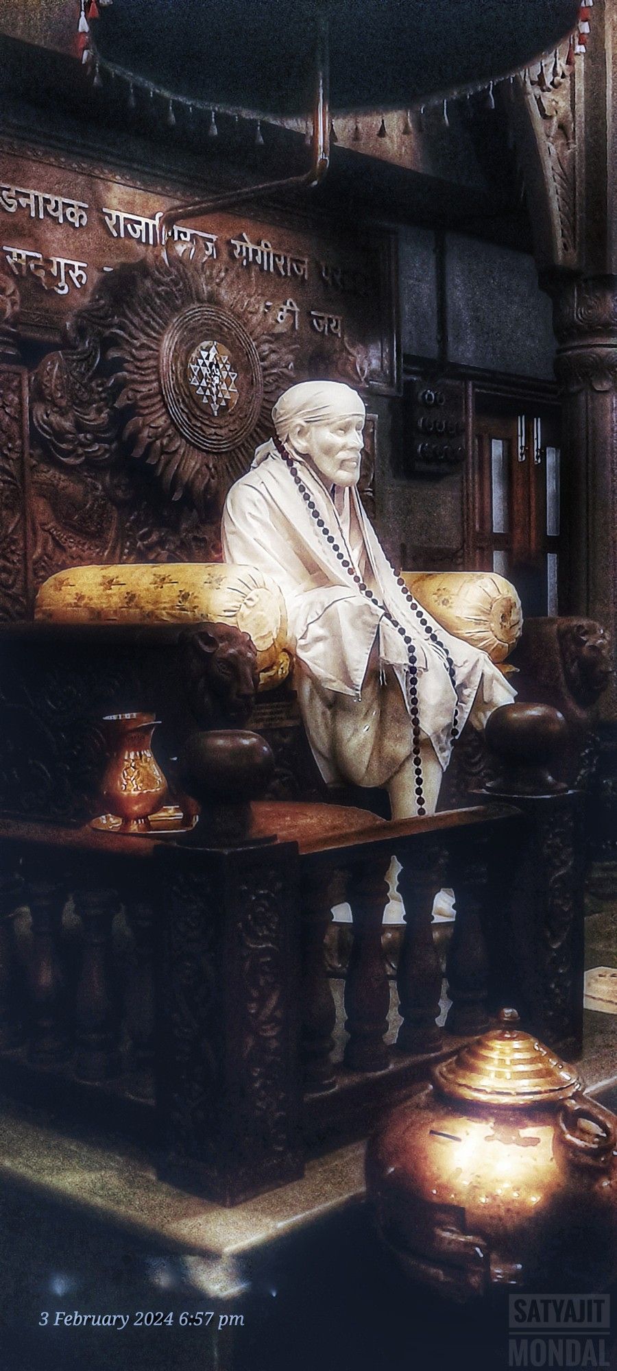 Sai Baba seated in Shirdi temple.