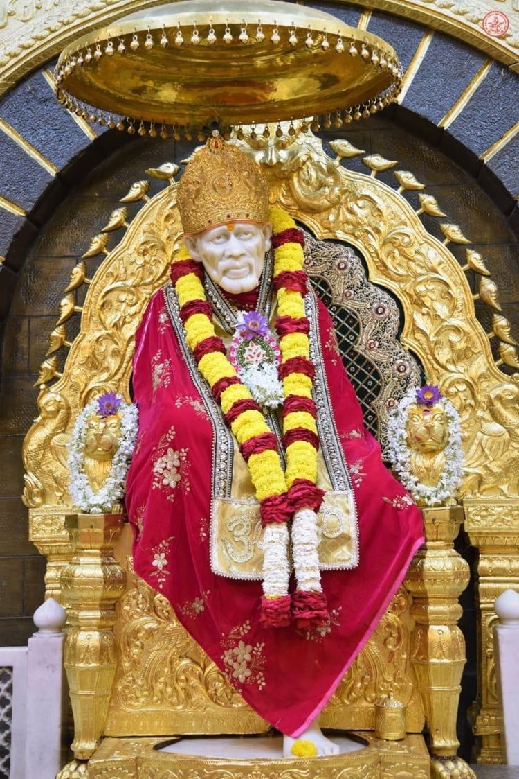 Sai Baba seated on golden throne