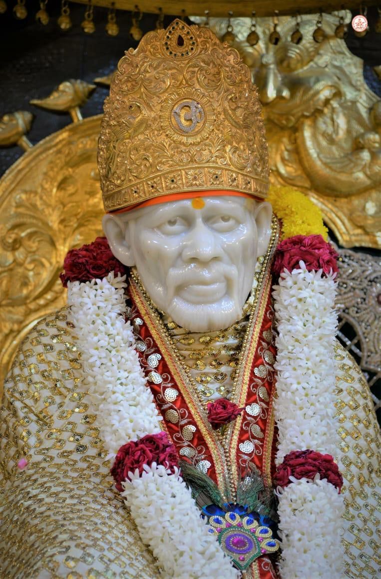 Sai Baba statue with golden crown