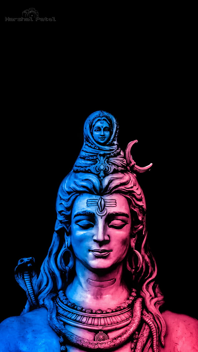 Lord Shiva meditating with trident and serpent.
