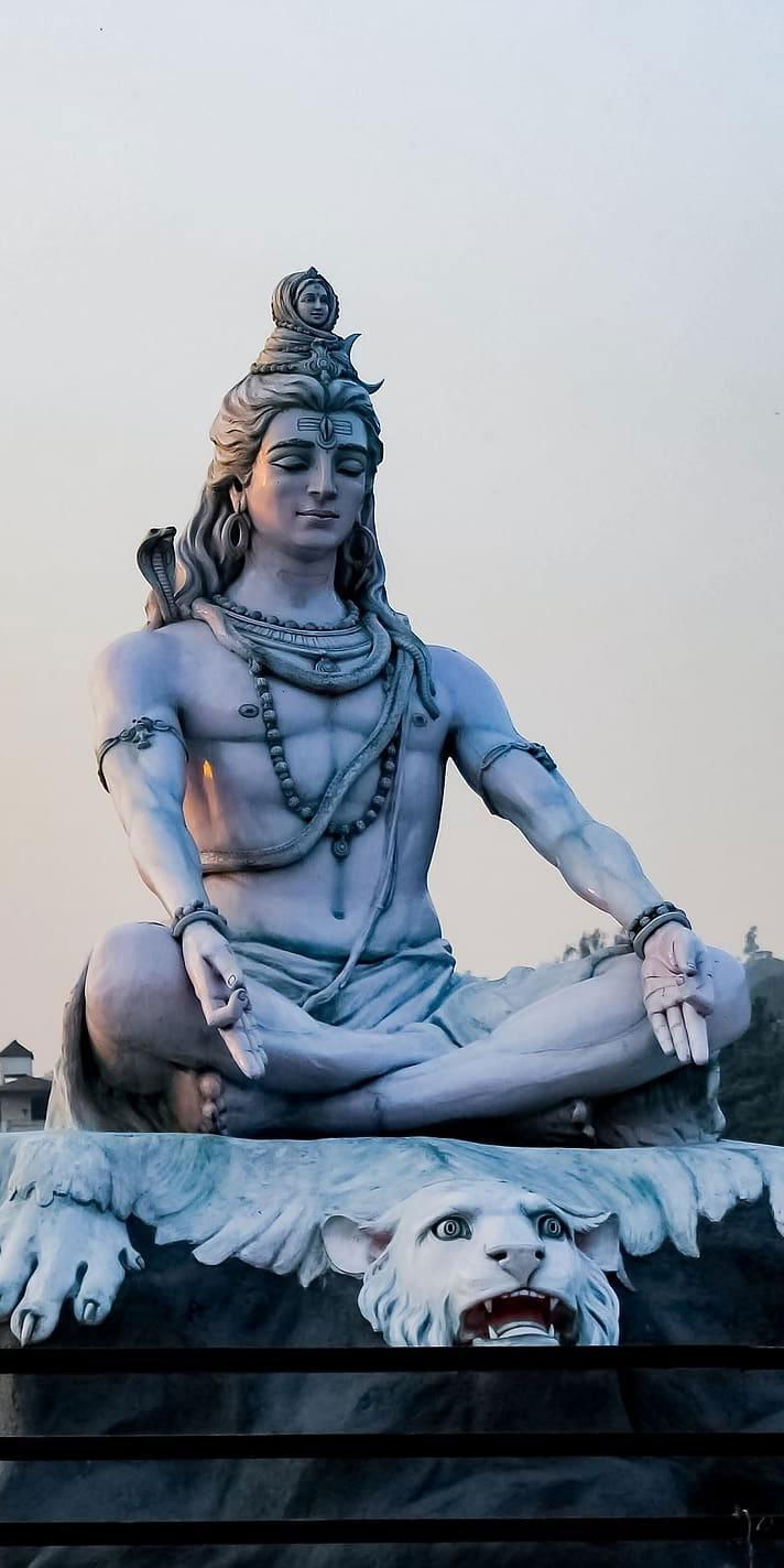 Meditating Shiva statue serene wallpaper