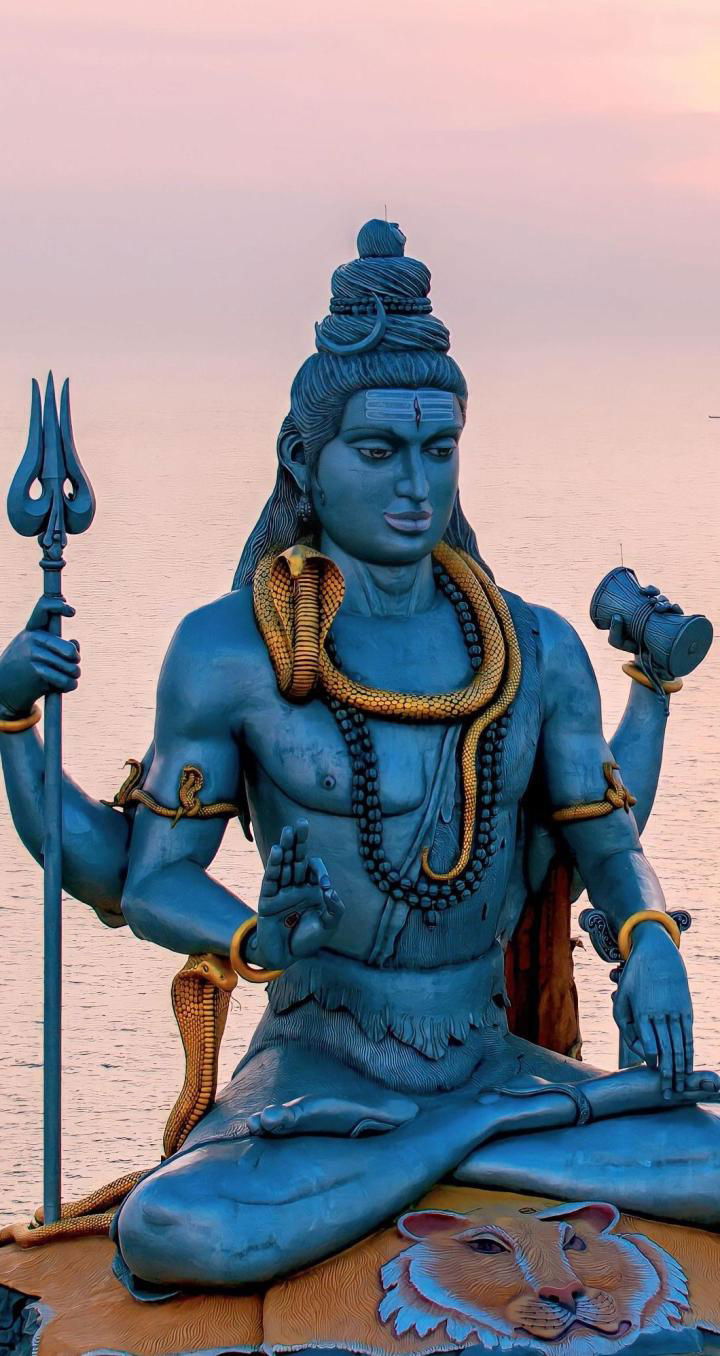 Shiva meditating by the ocean