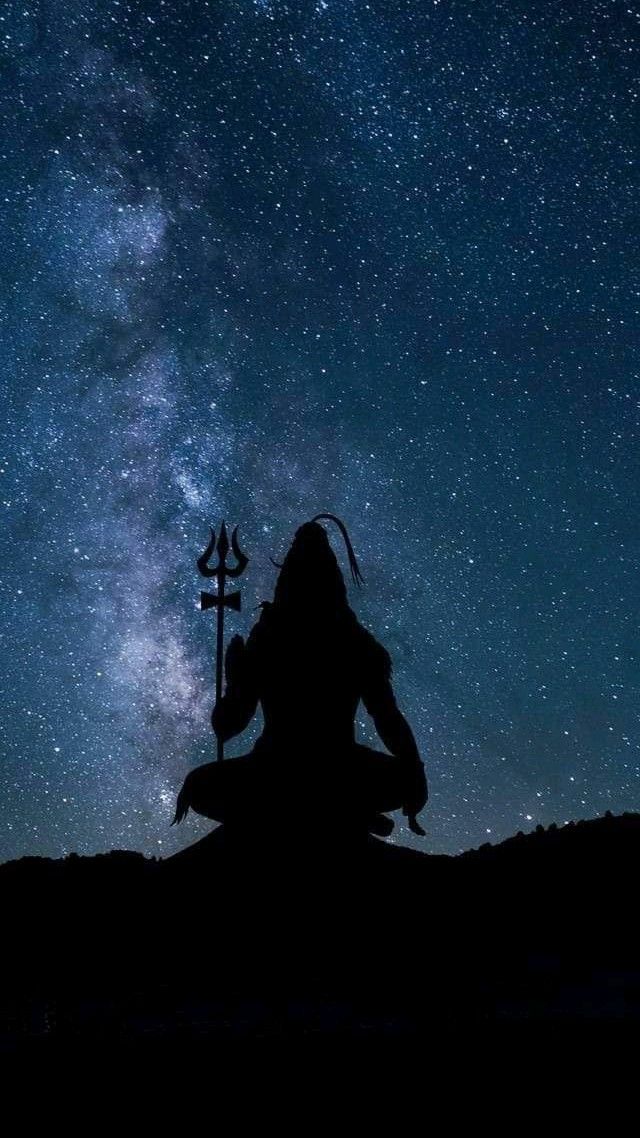 Shiva meditating in a starry night.