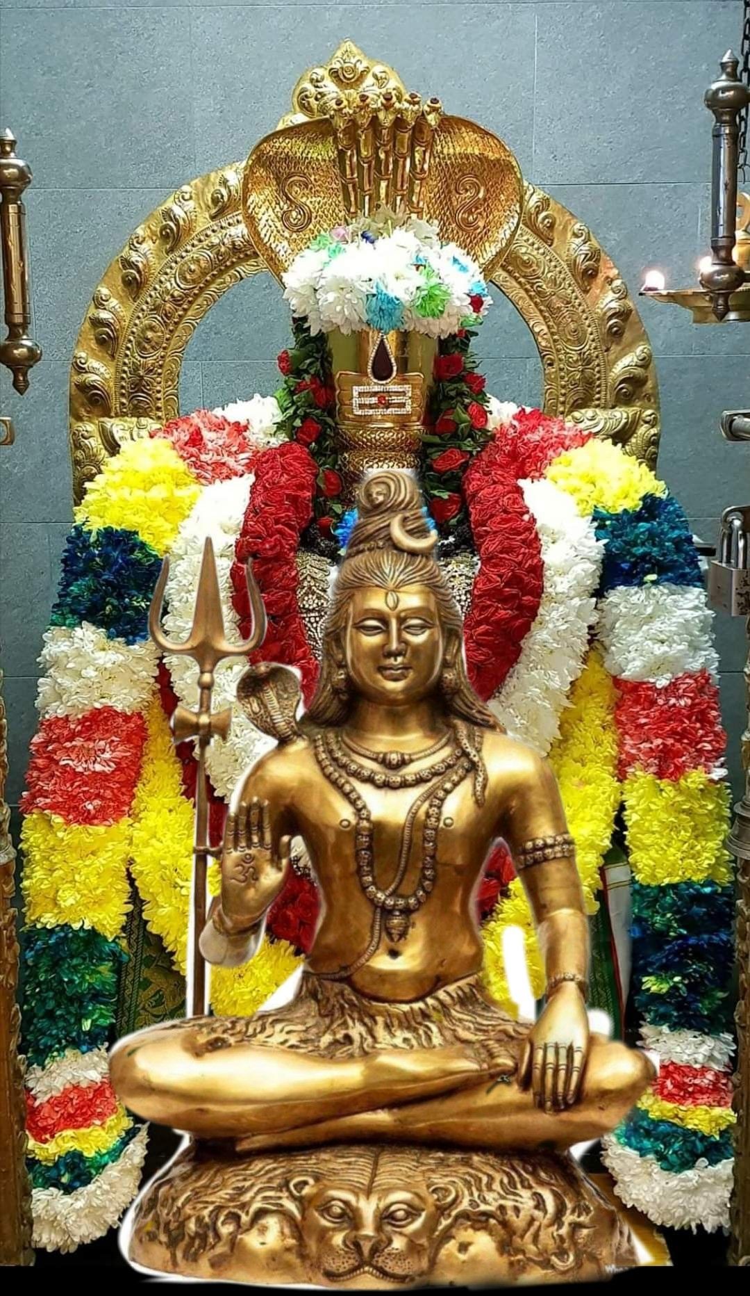 Golden statue of Lord Shiva seated
