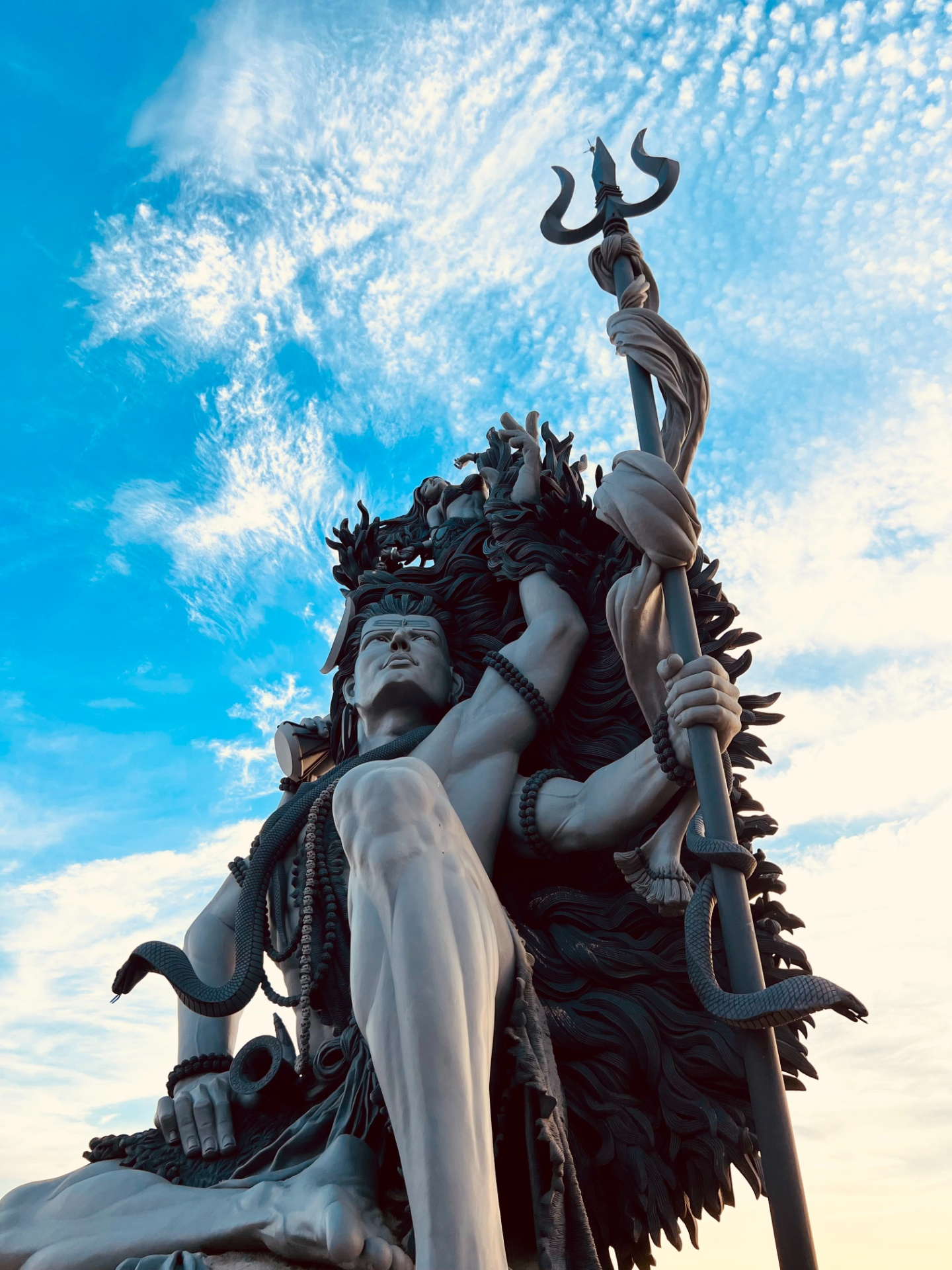 Lord Shiva statue against blue sky
