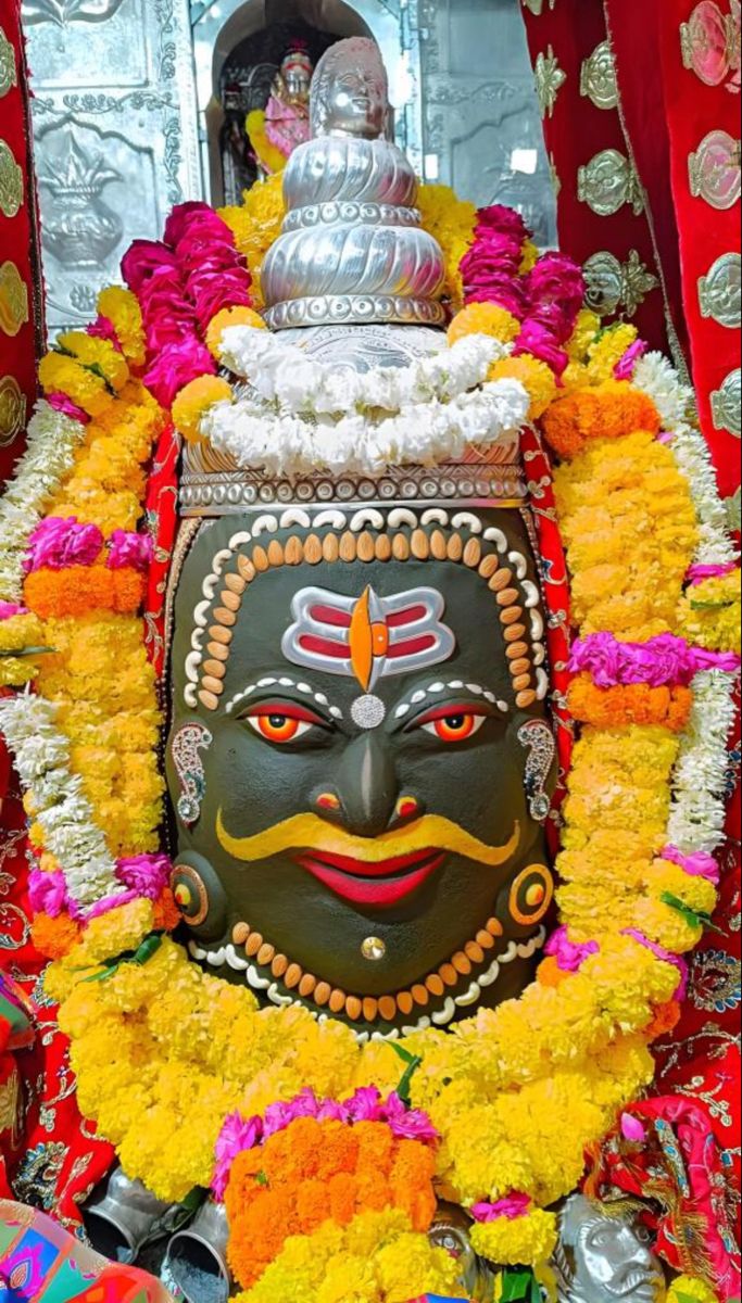 Shiva face with flower garland