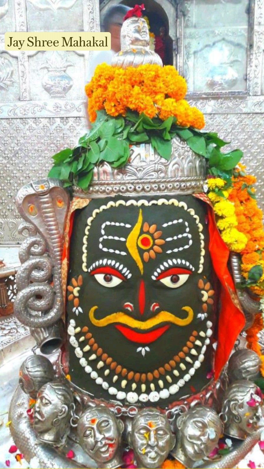 Lord Shiva\'s face with marigold garland