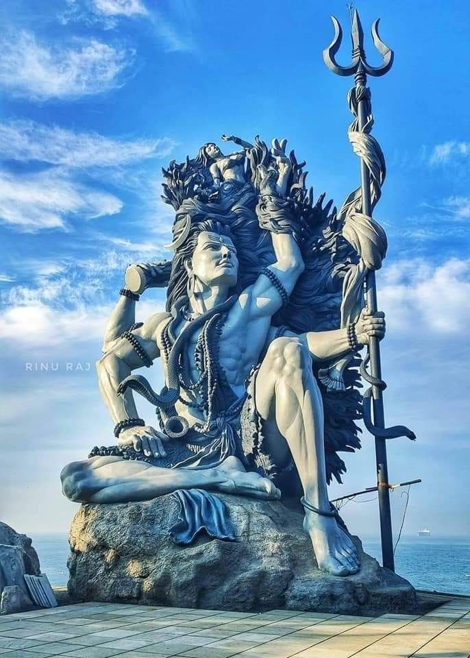 Shiva statue overlooking the ocean, majestic