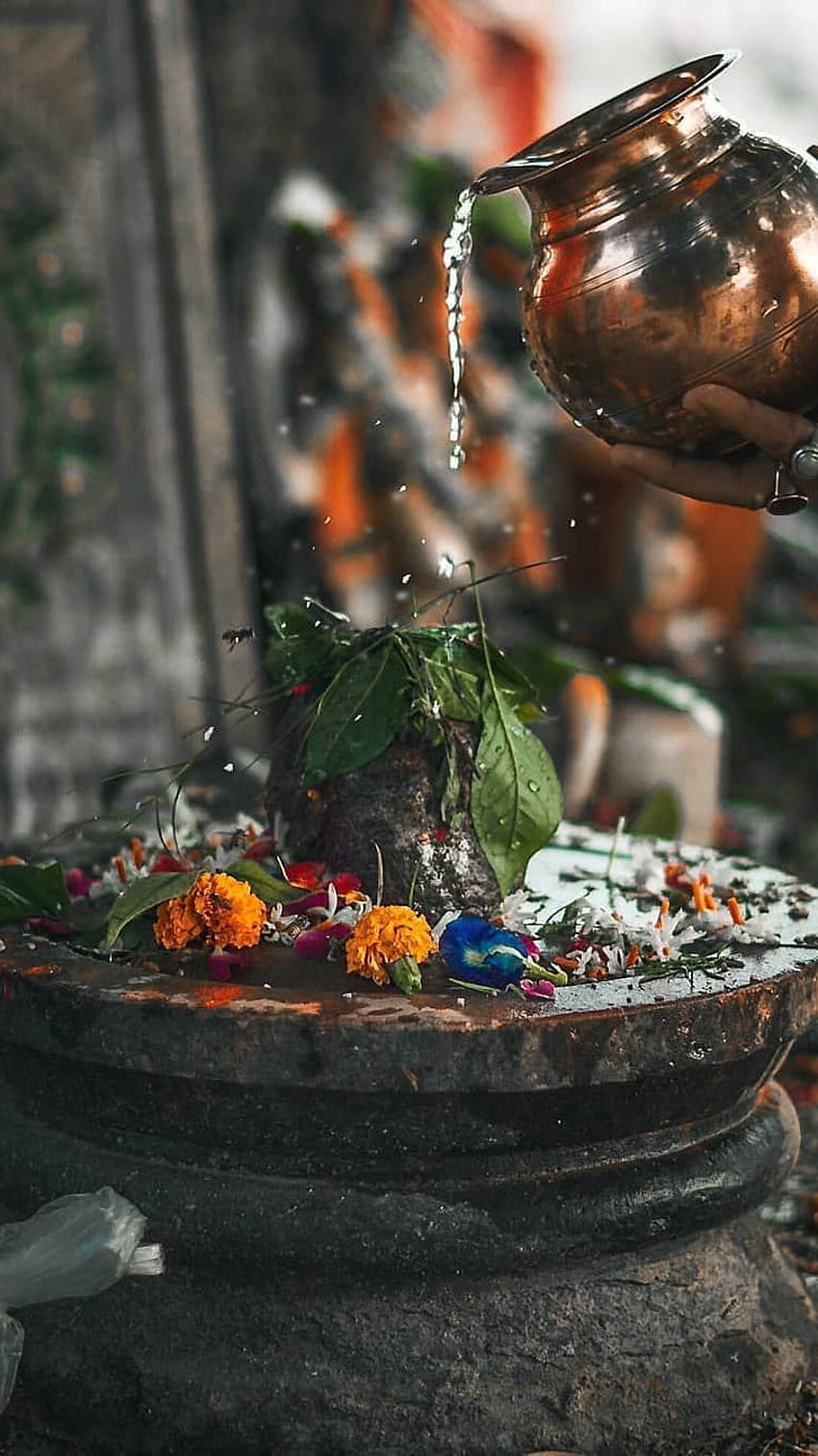 Water poured over shiva lingam