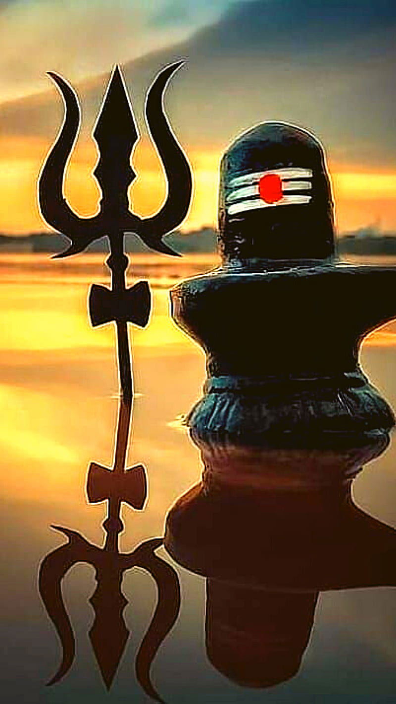 Shiva with Trishul against sunset backdrop