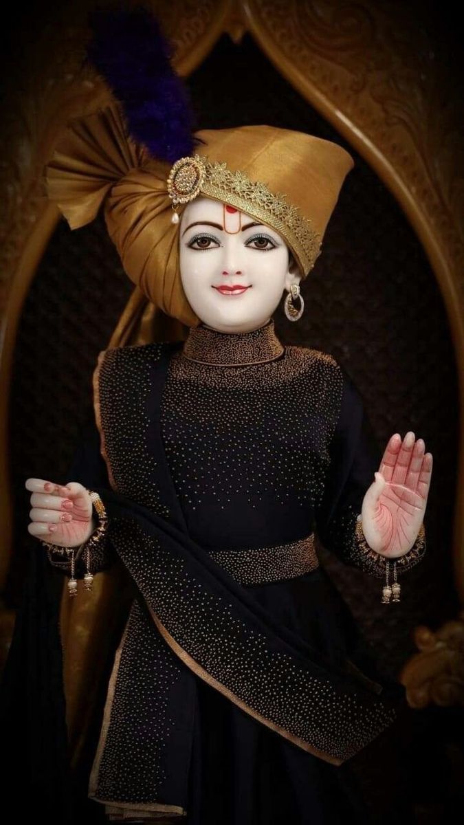 Swaminarayan in traditional attire blessing devotees