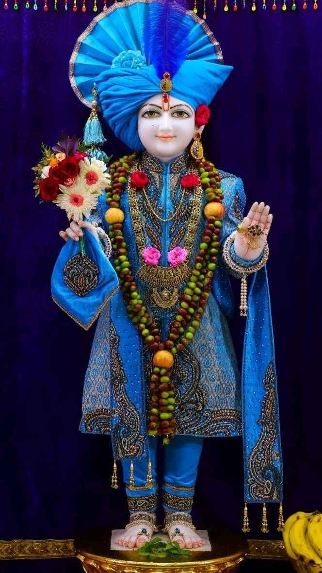 Swaminarayan murti with floral garland