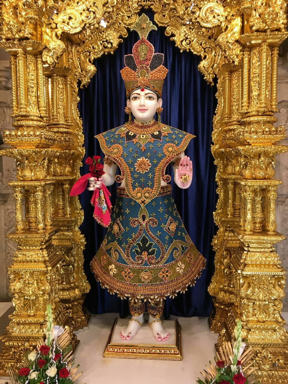 Swaminarayan Bhagwan in ornate temple setting