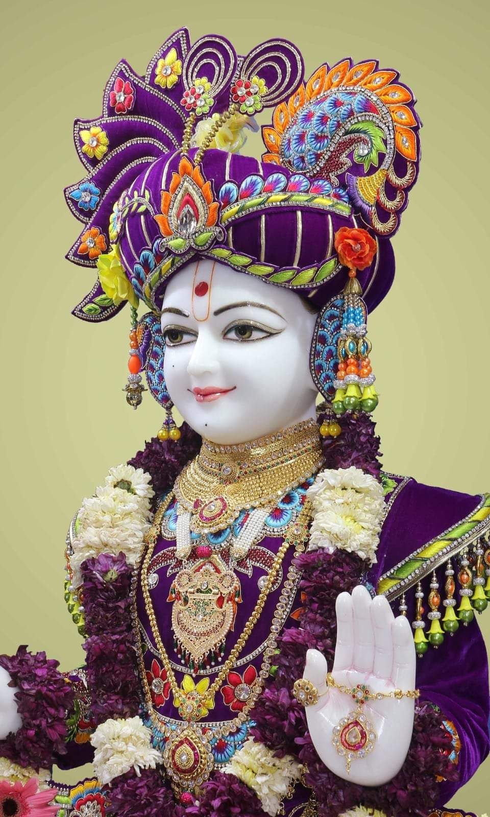 Swaminarayan Bhagwan with floral decorations