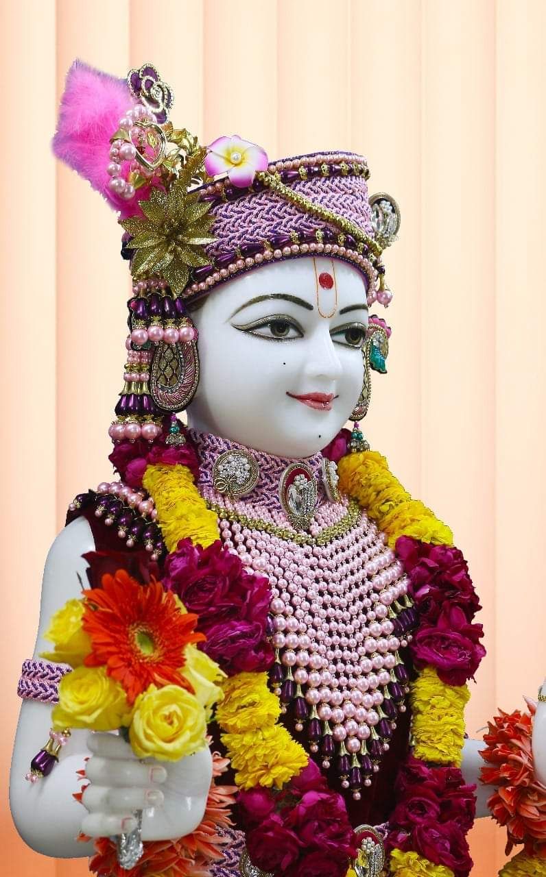 Swaminarayan adorned with vibrant flowers