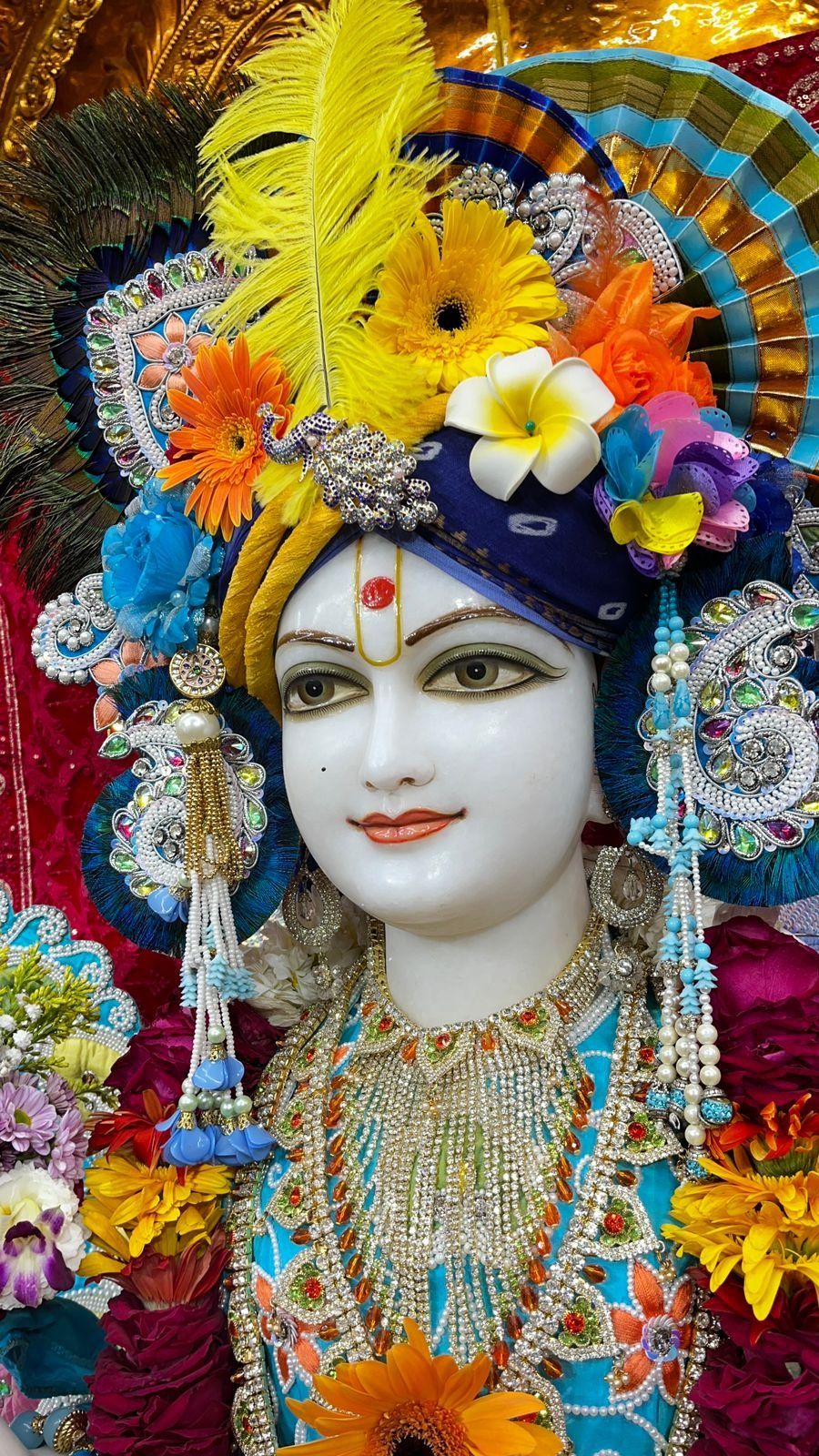 Swaminarayan adorned with a floral crown
