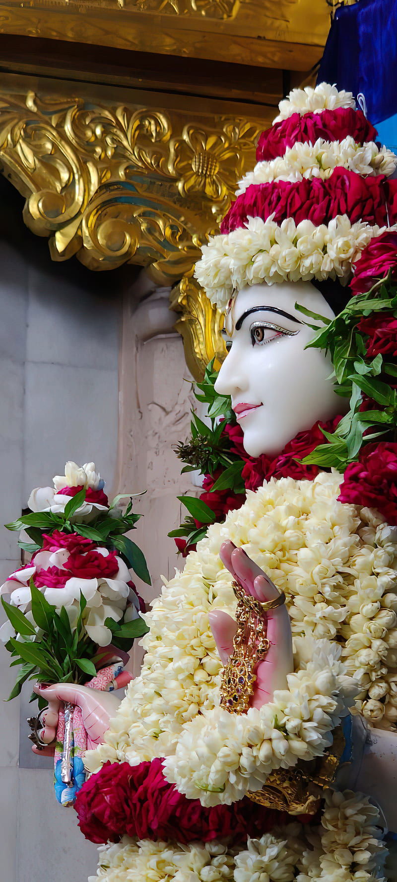Swaminarayan Bhagwan adorned with floral garlands.