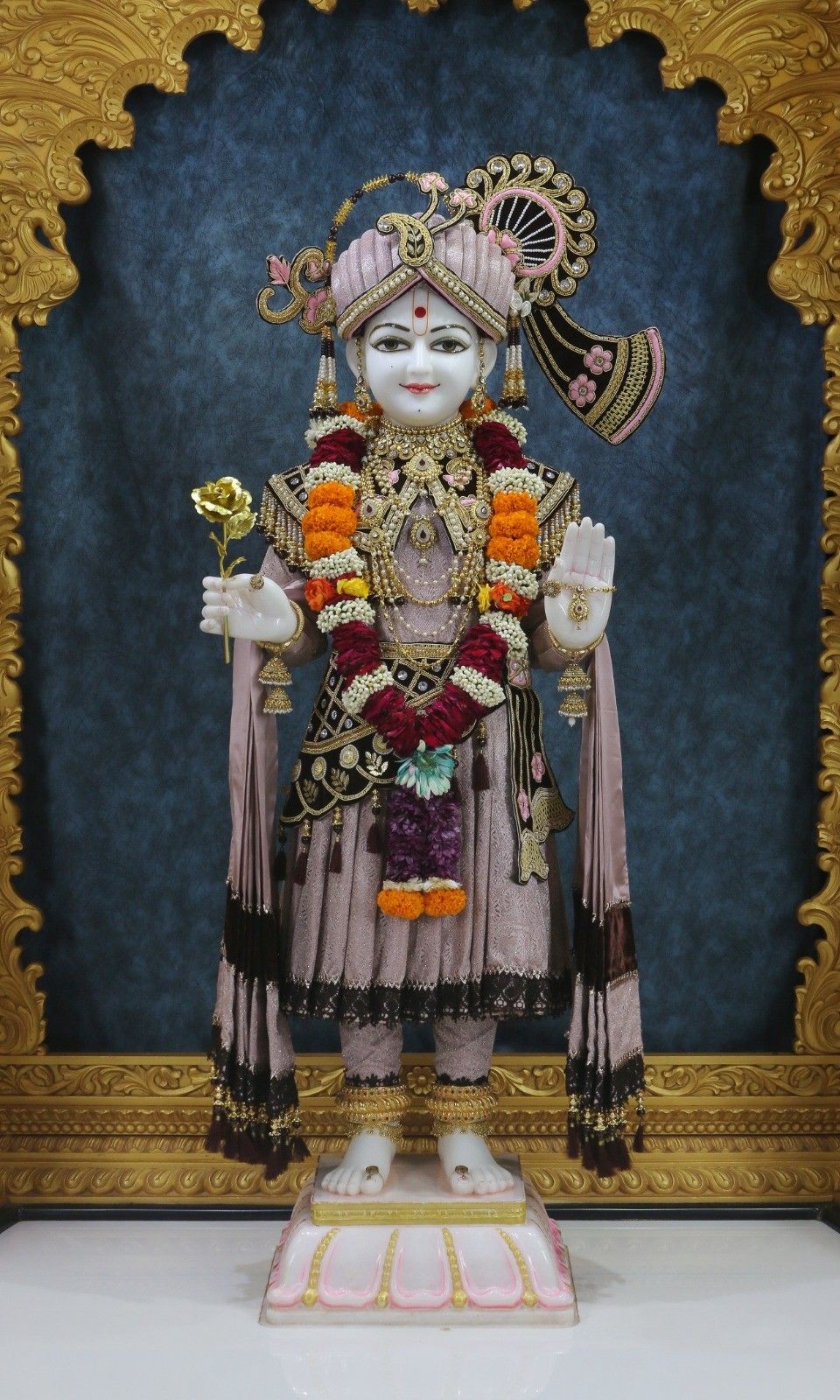 Swaminarayan adorned with floral garland
