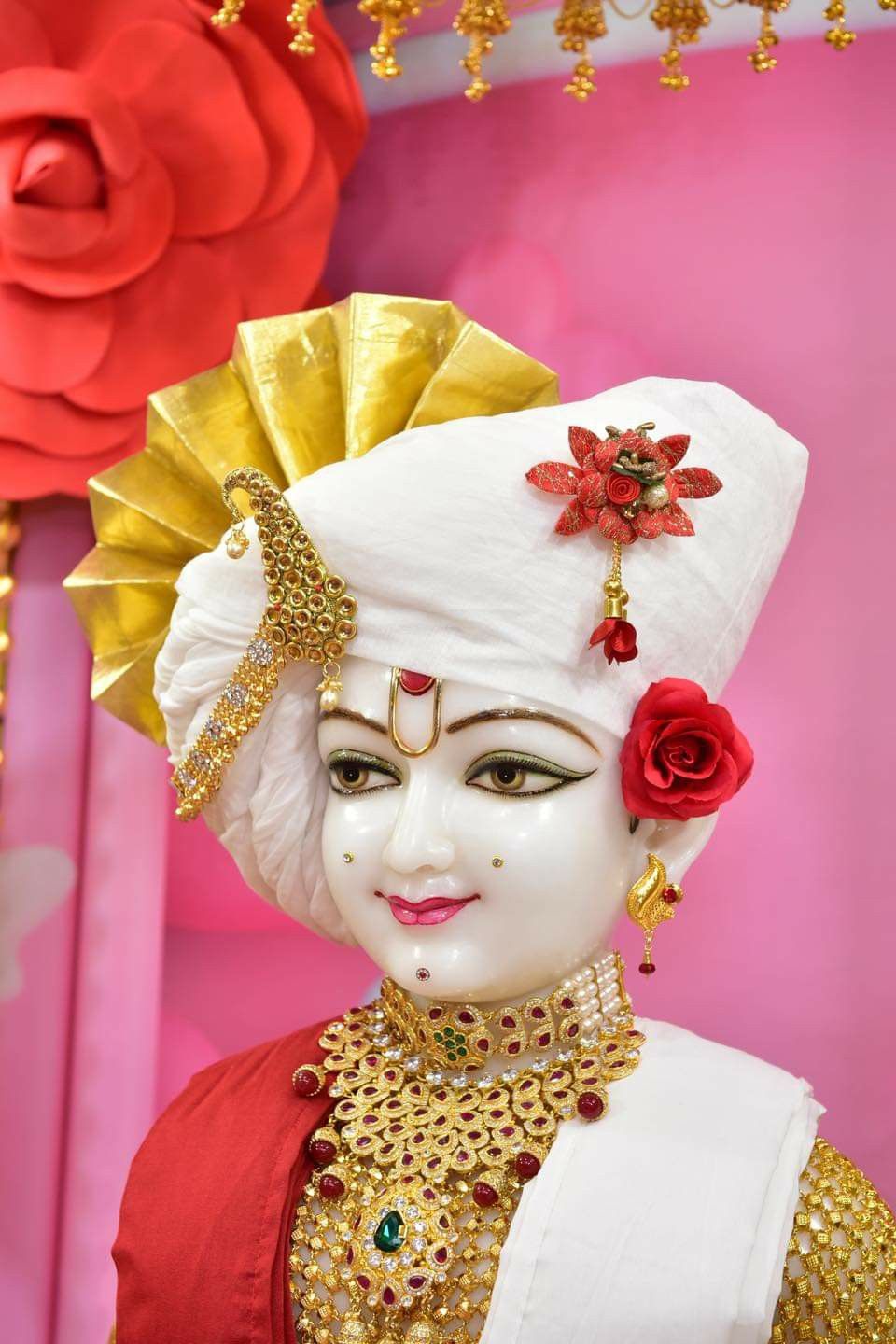 Swaminarayan with golden turban and jewelry