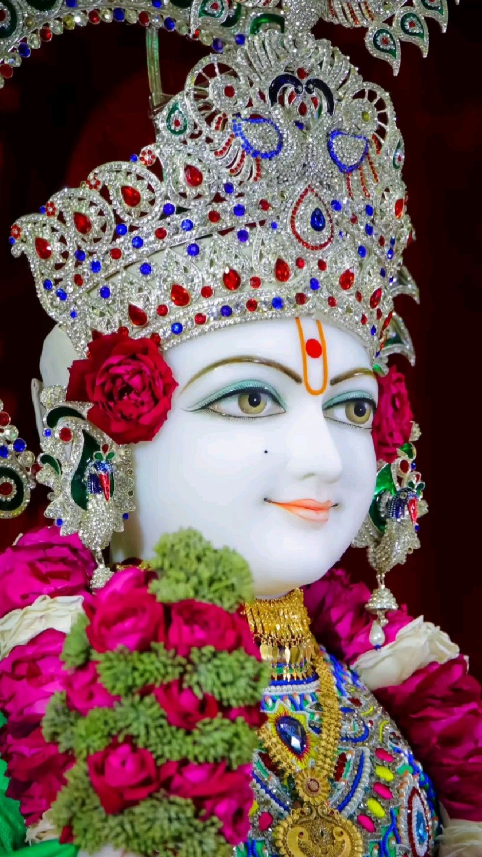 Swaminarayan with jeweled crown and flowers