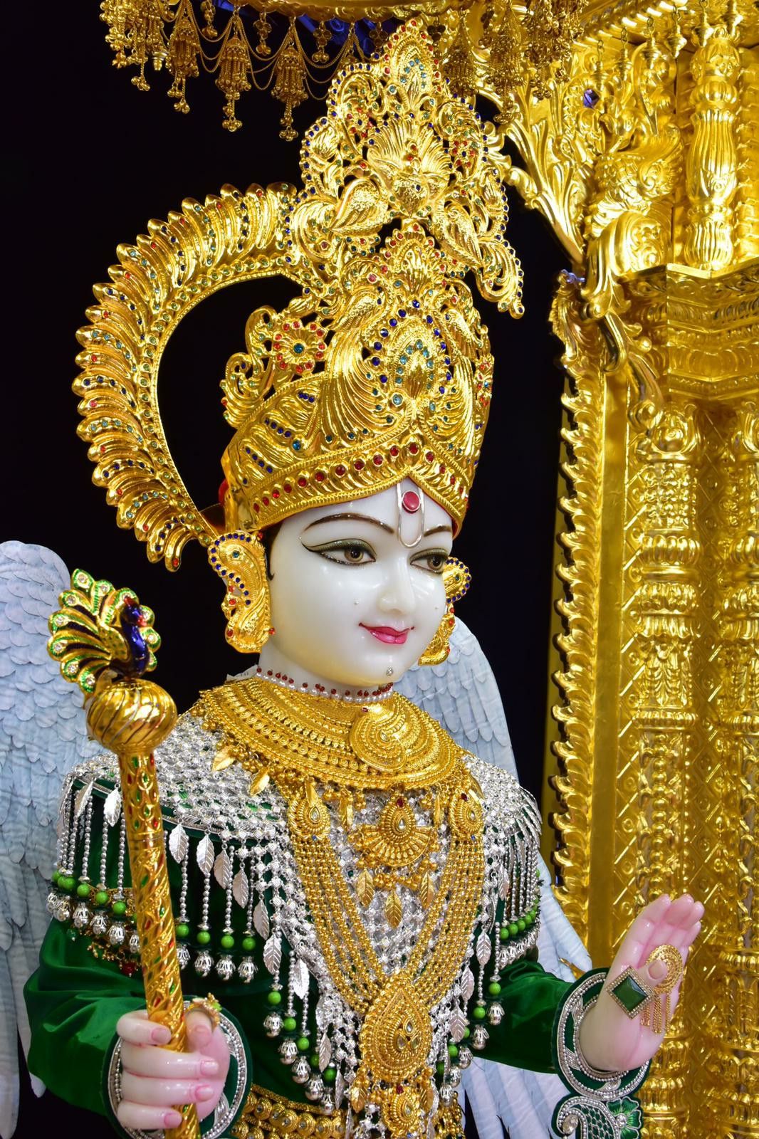 Swaminarayan with golden crown and jewelry
