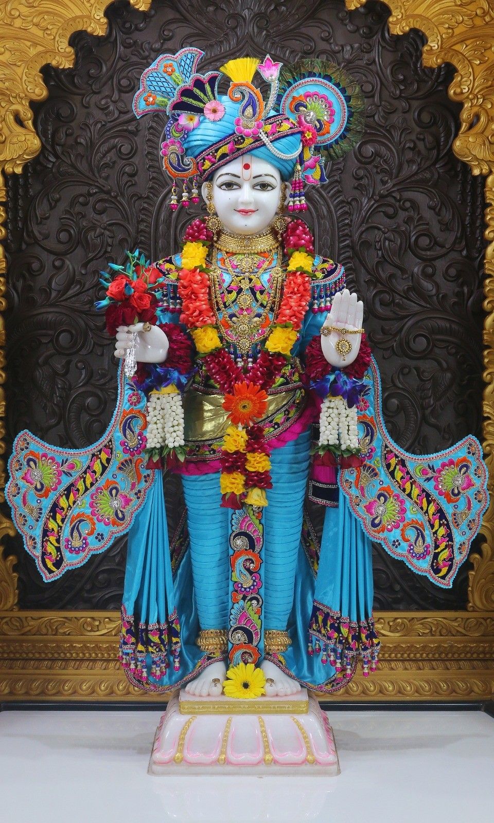 Swaminarayan Bhagwan with floral decorations
