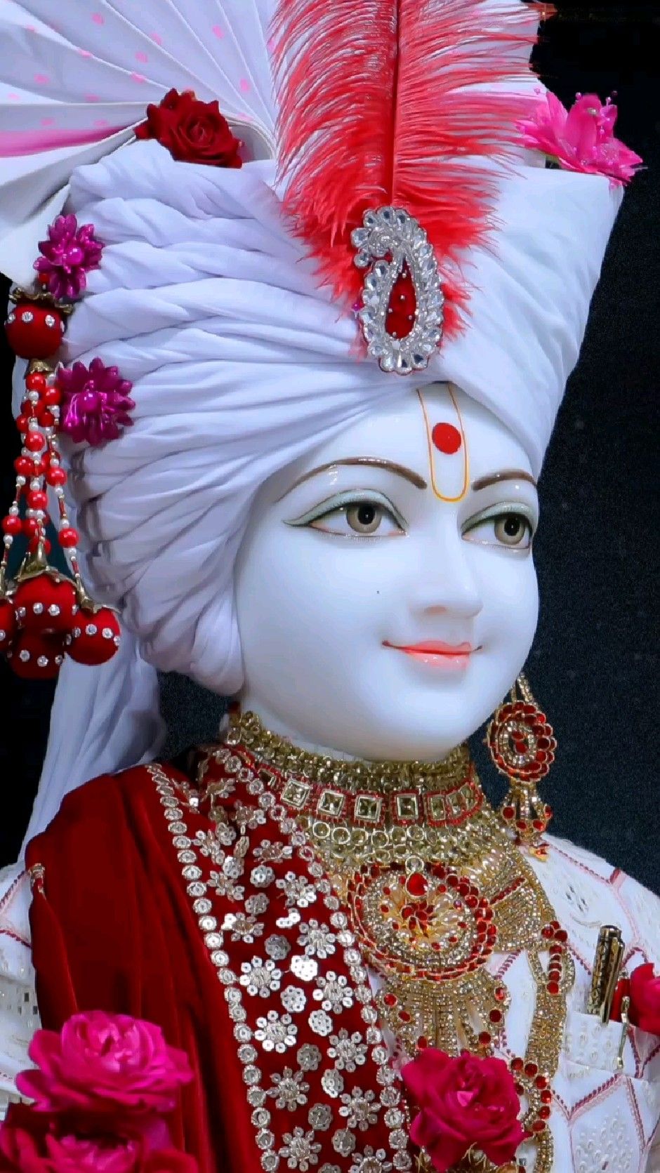 Swaminarayan with ornate headwear and jewelry