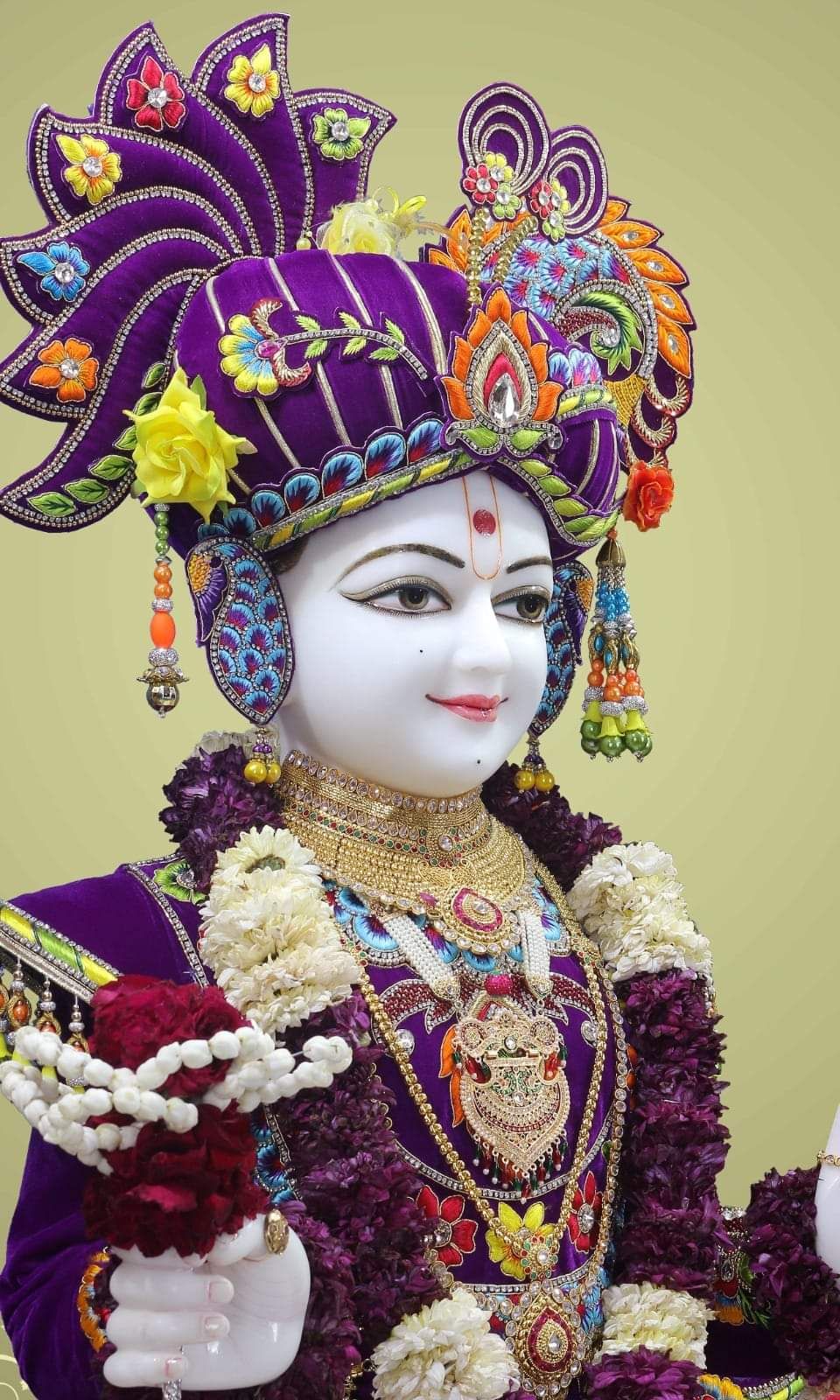 Swaminarayan with intricate floral crown