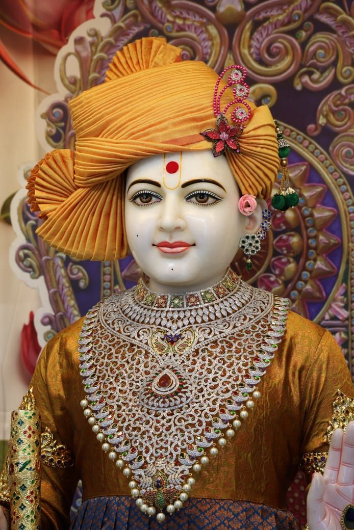 Shri Swaminarayan with golden crown and necklace