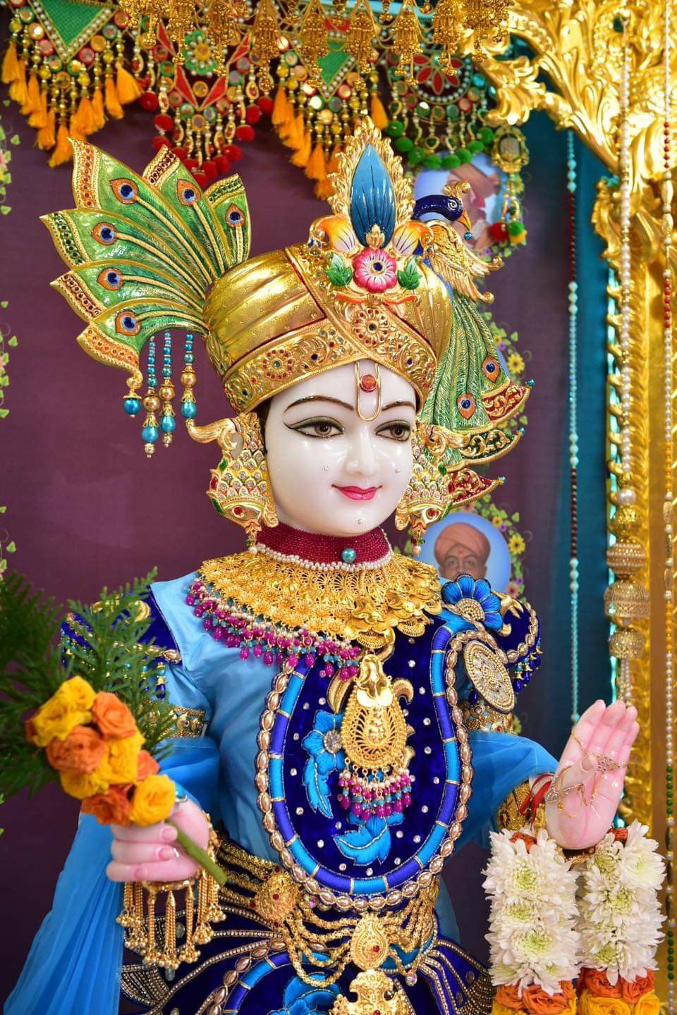 Swaminarayan adorned with jewelry and crown