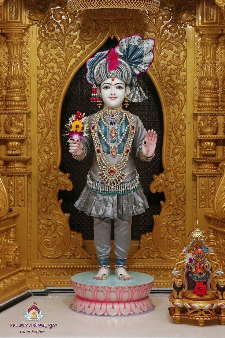 Swaminarayan deity in ornate golden frame