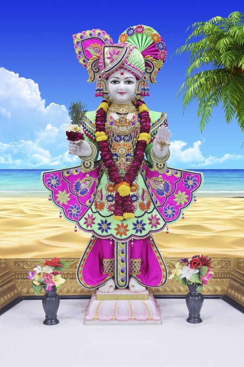 Swaminarayan murti on a beautiful beach.