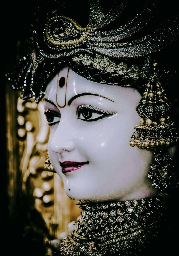 Close-up of Swaminarayan\'s serene face.