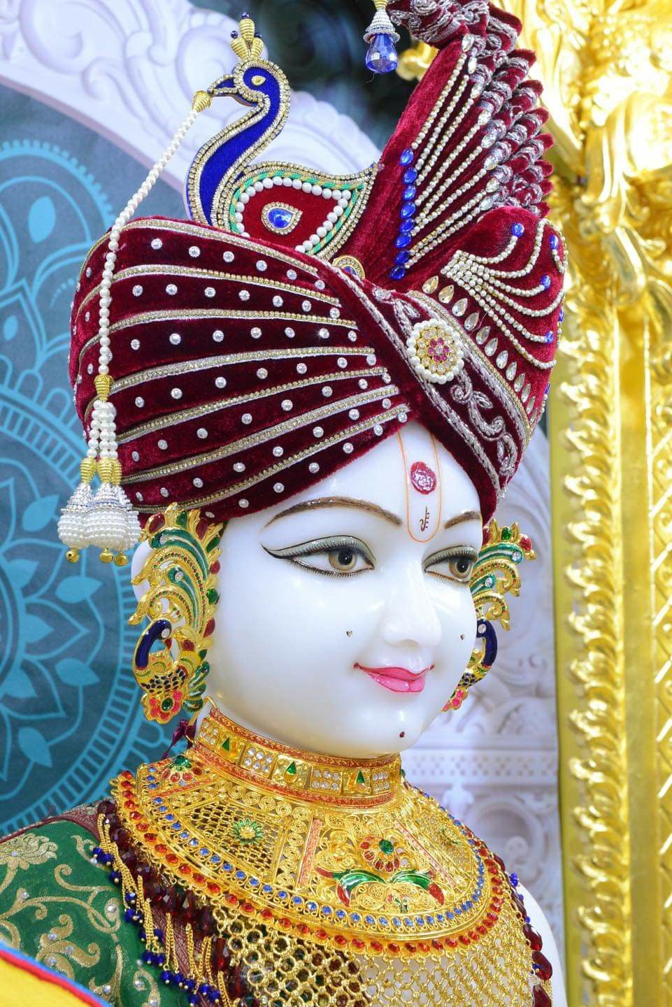 Close-up of Swaminarayan with peacock crown