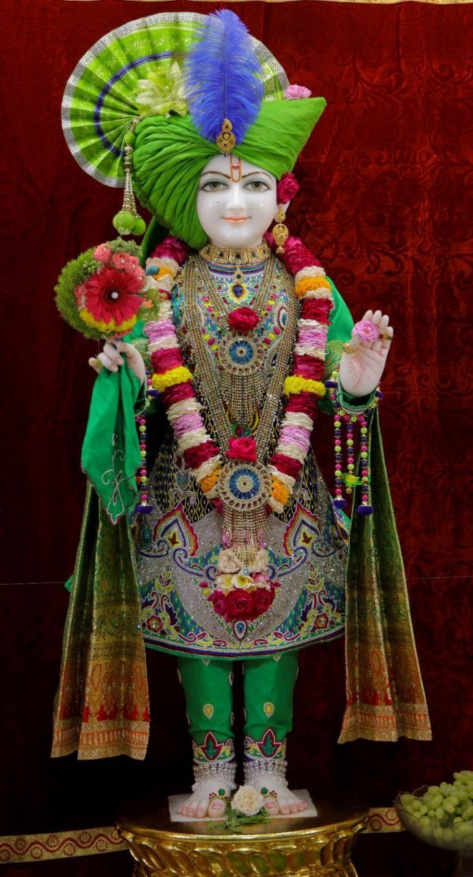Swaminarayan Bhagwan in vibrant green attire