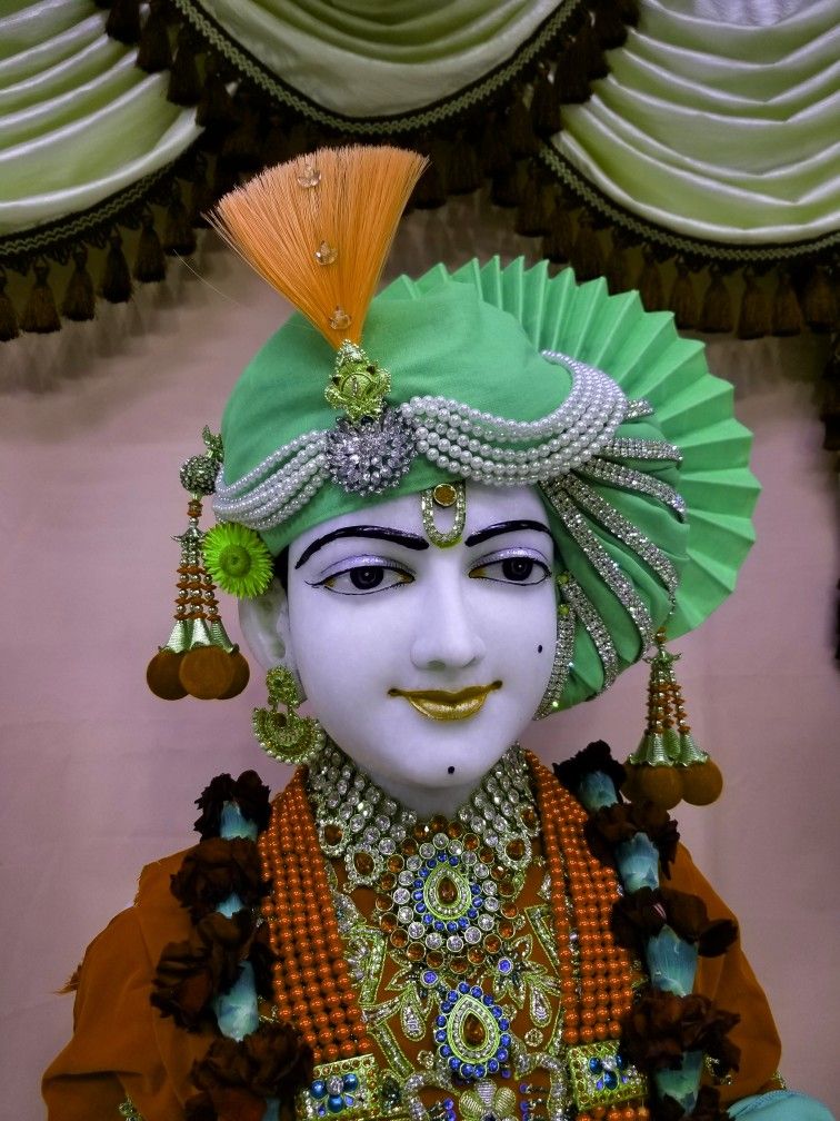 Swaminarayan with ornate green turban