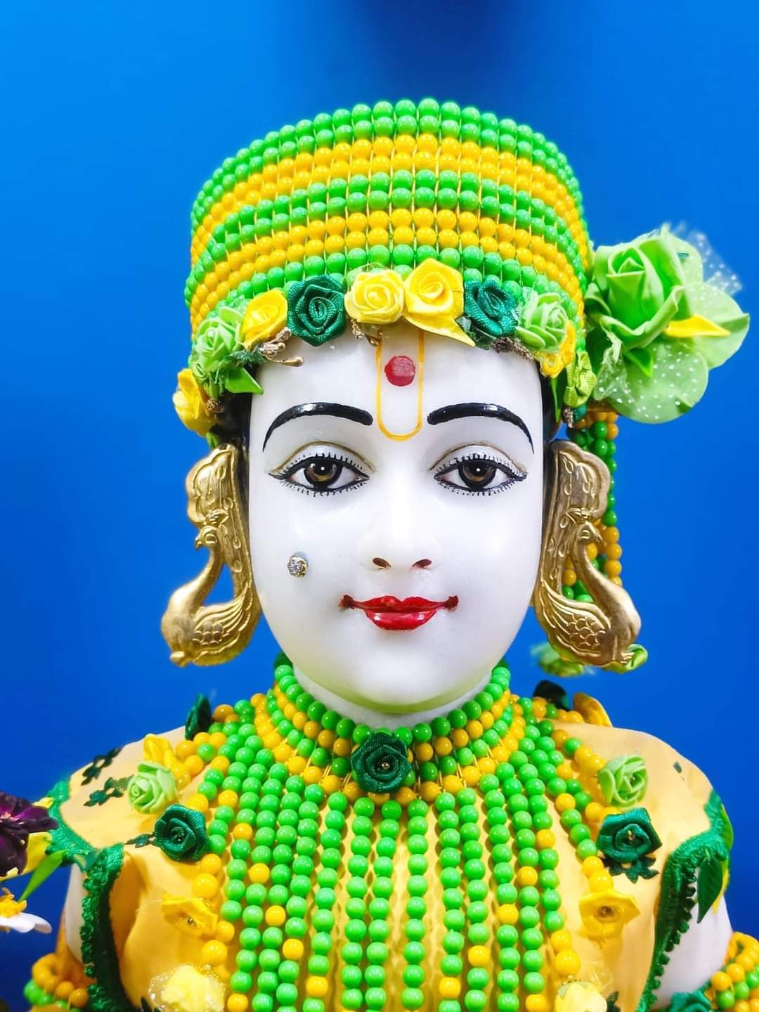 Swaminarayan with floral crown, divine portrait