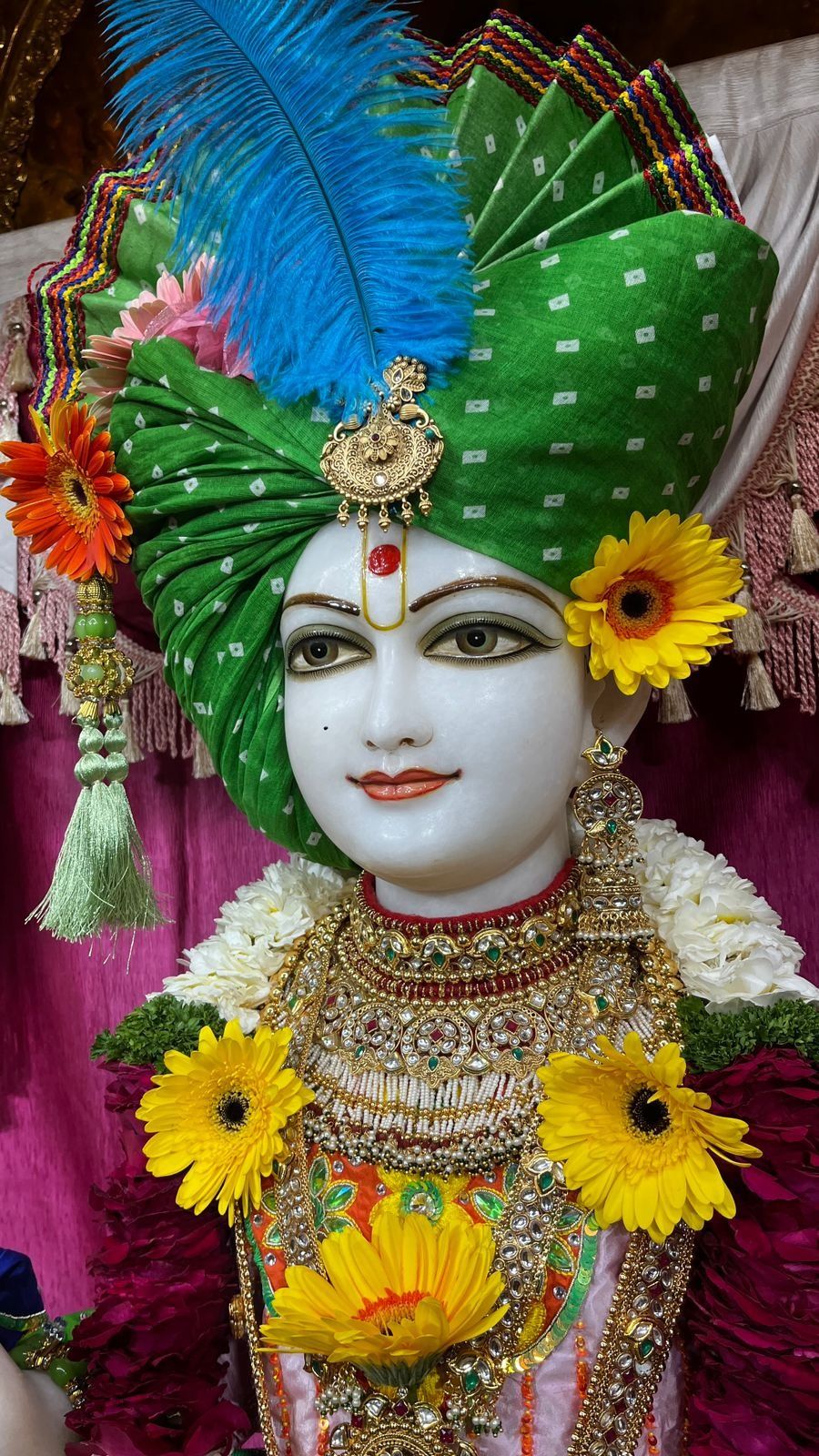 Swaminarayan with floral garland and turban