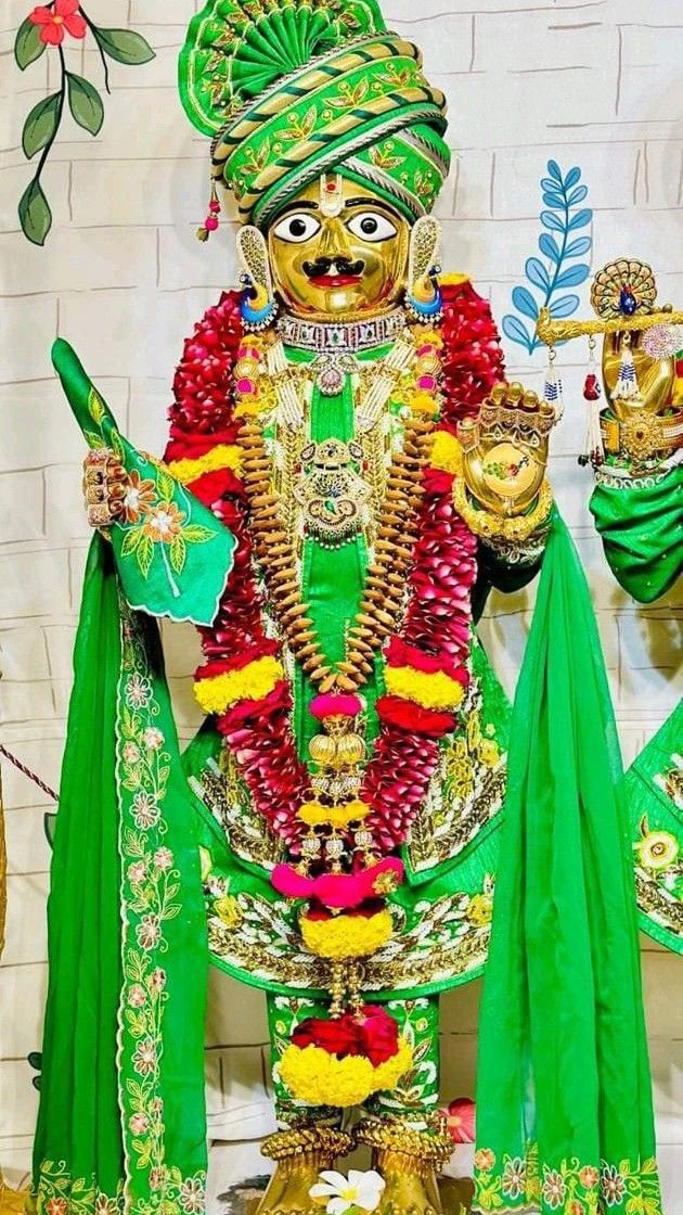 Swaminarayan Bhagwan adorned in green attire