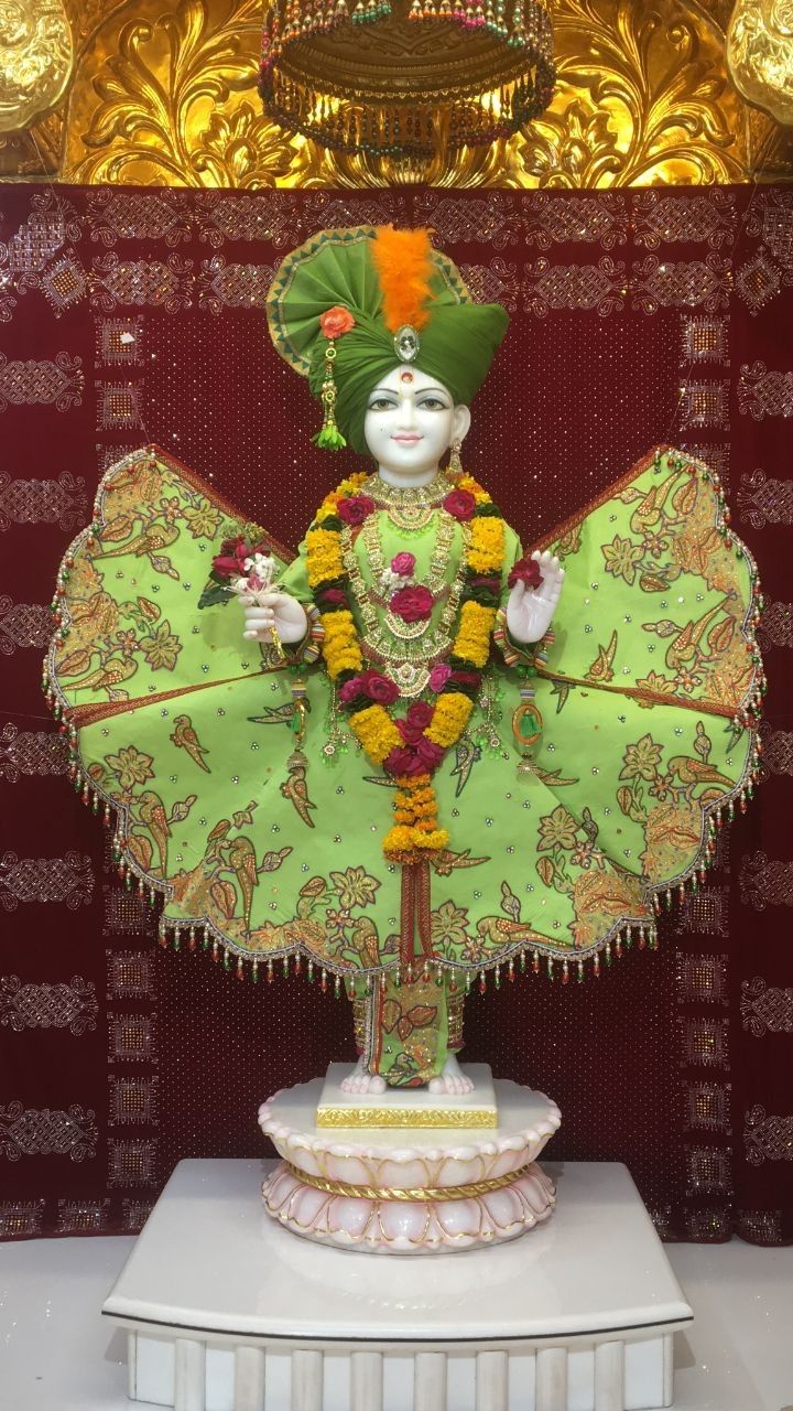 Swaminarayan Bhagwan statue with floral garland
