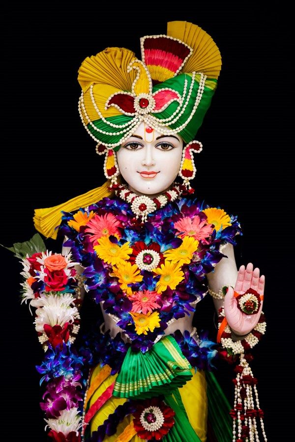 Swaminarayan adorned with floral garland.